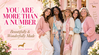 Women celebrating confidence and self-worth at The Pink Doxie boutique.
