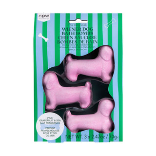 Three pink wiener dog-shaped bath bombs in packaging with green stripes.