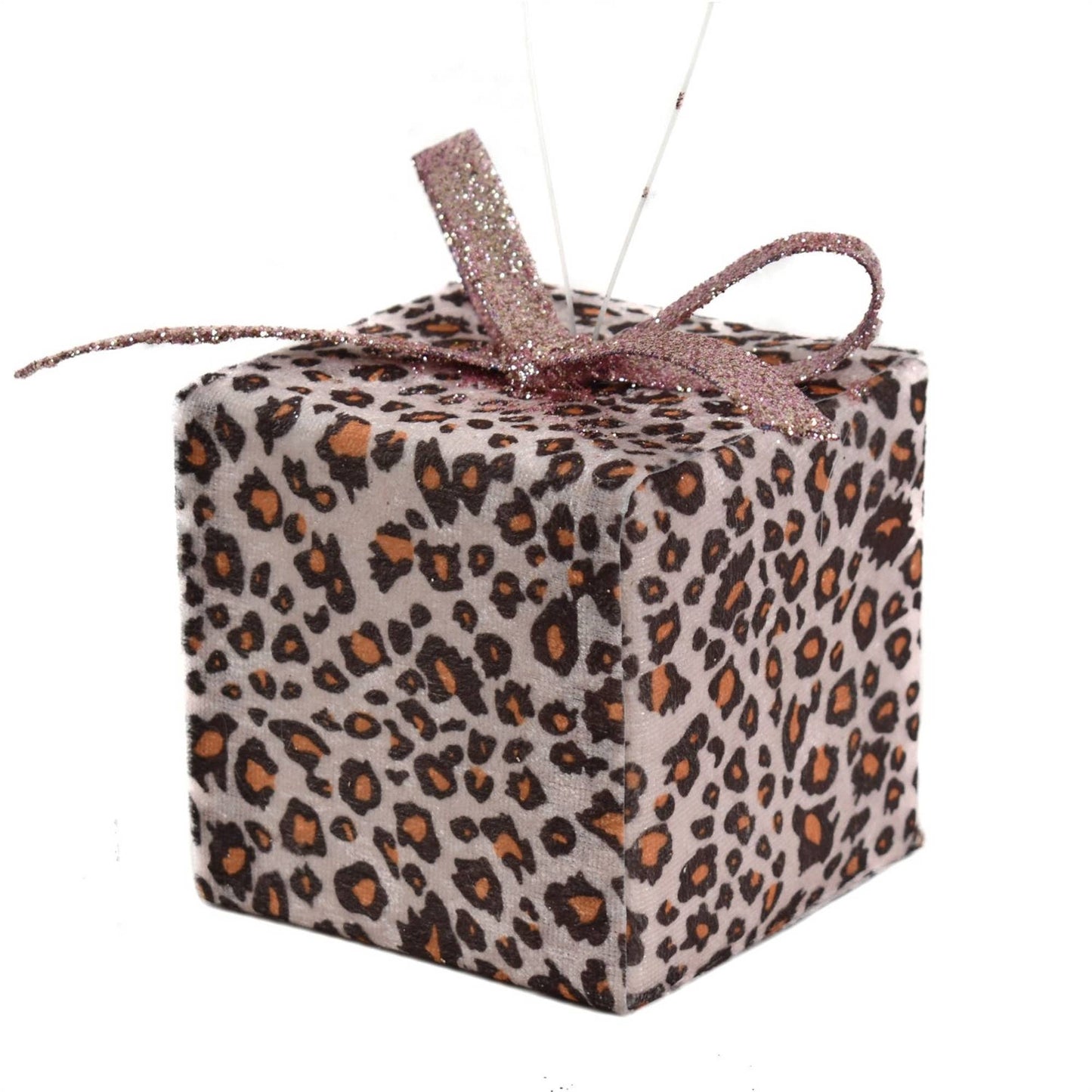 Close-up of leopard Christmas ornament with pink shimmer ribbon.