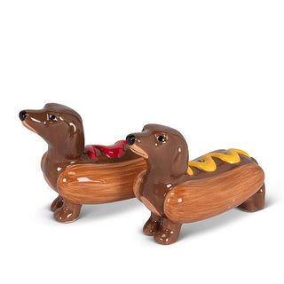 Two ceramic Dachshund hot dog salt and pepper shakers with ketchup and mustard details.