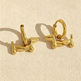 Gold plated hoop earrings with dachshund charms and seamless hinge closure.