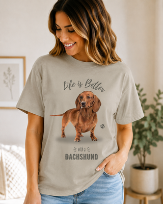 Light beige unisex T-shirt with dachshund graphic and 'Life is Better with a Dachshund' text.