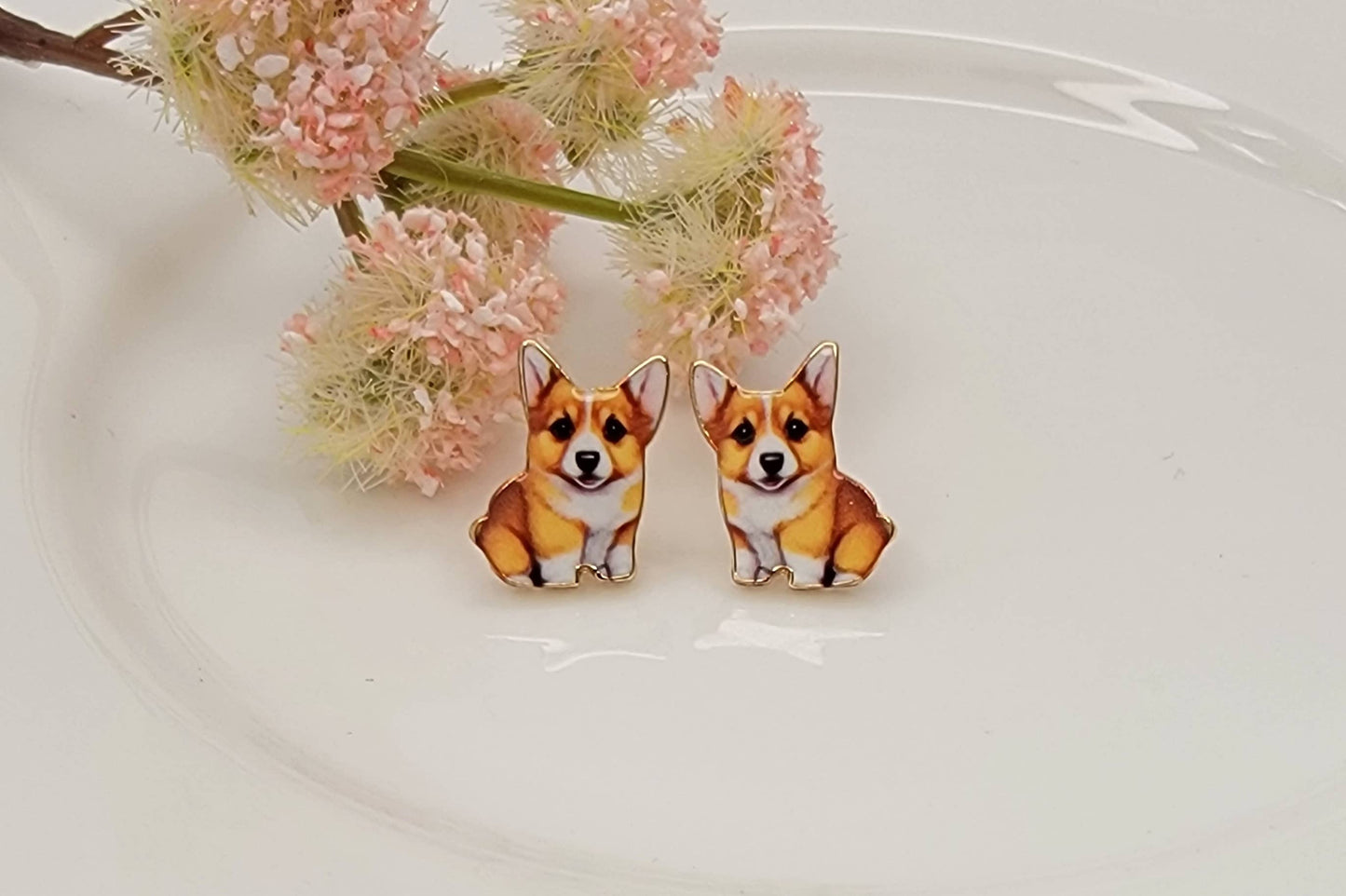 Corgi post earrings with gold-tone outline displayed on a white background from The Pink Doxie Boutique.