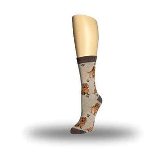 A beige sock featuring a red dachshund pattern, shown on a mannequin leg.