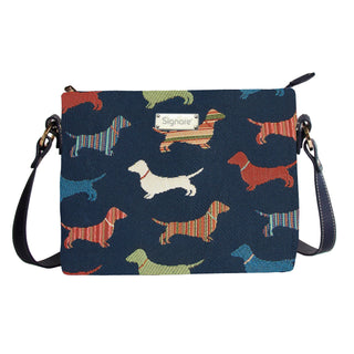 Crossbody bag with a multicolor dachshund tapestry design and adjustable strap.