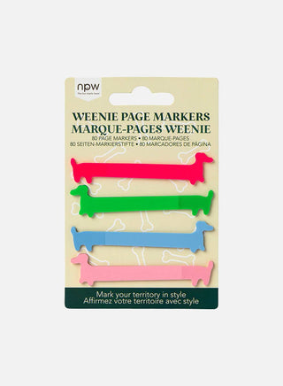 Four colorful sausage dog-shaped page markers in pink, green, blue, and orange.