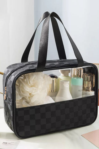 Black checkered clear PVC cosmetic bag with handles, filled with skincare and beauty products, stylish and travel-friendly from The Pink Doxie Boutique.