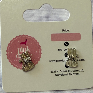 Pair of brushed silver cat earrings on a Pink Doxie branded card with contact information.