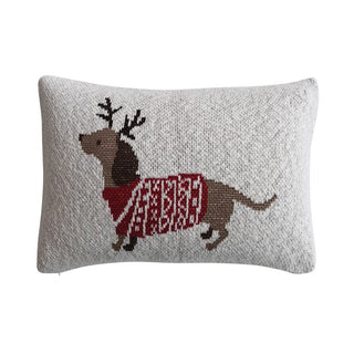Lumbar pillow with a knit design featuring a brown dachshund in a red sweater and reindeer antlers on a light heather gray background.