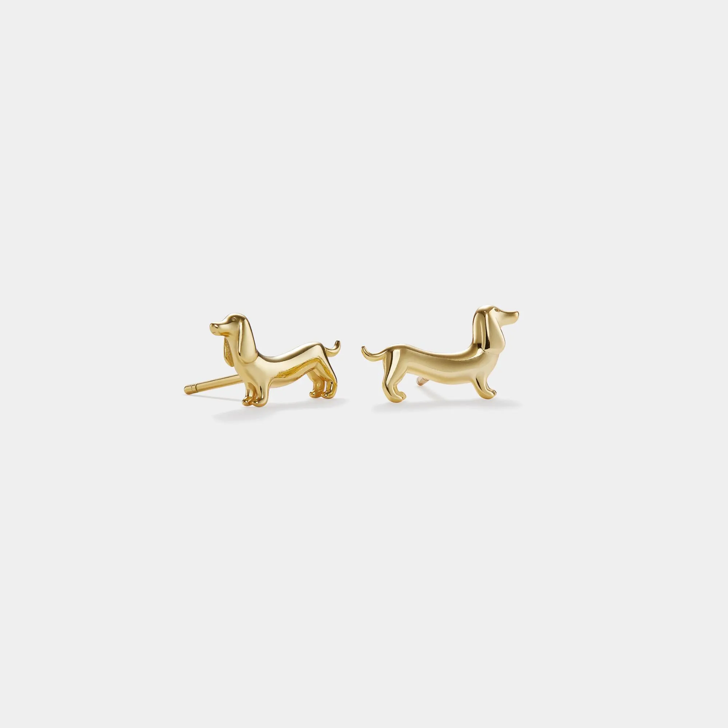 Gold dachshund dog stud earrings in sterling silver featuring a sleek long-body design — handcrafted Doxie jewelry from The Pink Doxie.