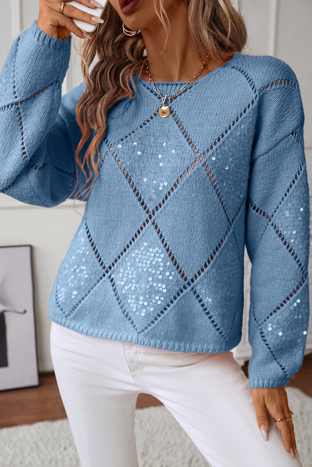 Model wearing Dusk Blue sequin knit sweater with hollowed rhombus pattern and relaxed fit.