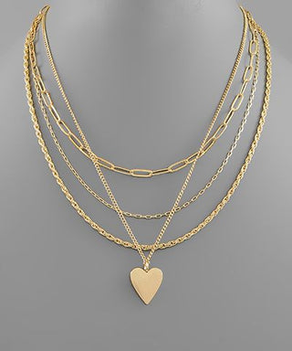 Three-layer gold chain necklace with heart pendant, photographed for The Pink Doxie Boutique.