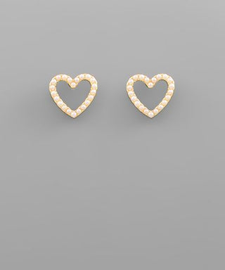 Pearl heart stud earrings with faux pearl accents and gold-tone outline displayed on a neutral background from The Pink Doxie Boutique.