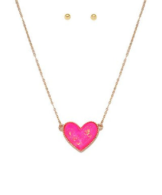 Pink resin heart pendant necklace with gold flake detail on a gold-tone chain, photographed for The Pink Doxie Boutique.