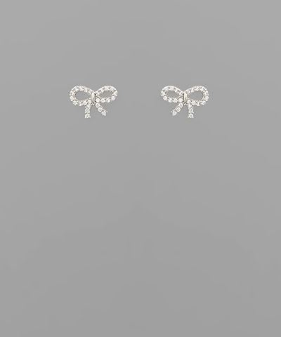 Small crystal ribbon bow stud earrings in gold and silver tones displayed on a neutral background from The Pink Doxie Boutique.