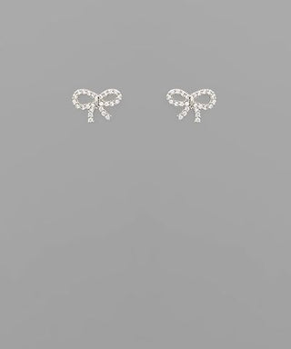Small crystal ribbon bow stud earrings in gold and silver tones displayed on a neutral background from The Pink Doxie Boutique.