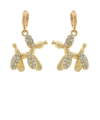 Gold-tone balloon dog dangle earrings with crystal accents and post backs displayed on a white background from The Pink Doxie Boutique.