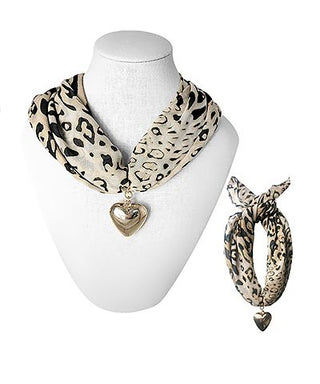 Leopard scarf necklace with gold heart charm on display bust
