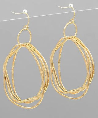 Uneven circle layered metal dangle earrings with fish hook closure in gold, matte gold, and matte silver from The Pink Doxie Boutique.