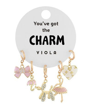 Gold charm set featuring bows, heart, poodle, and parasol