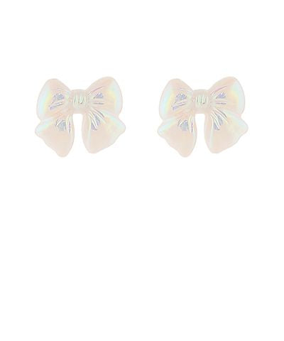 White acrylic bow stud earrings with a subtle iridescent sheen and gold-dipped accents on a white background from The Pink Doxie Boutique.