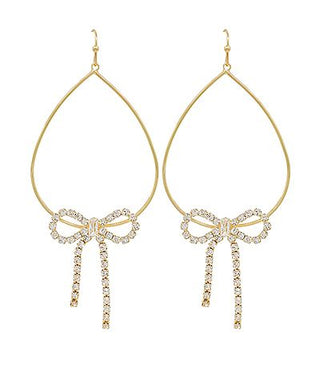 Gold teardrop earrings with sparkling crystal bow accents and dangling crystal details displayed on a white background from The Pink Doxie Boutique.