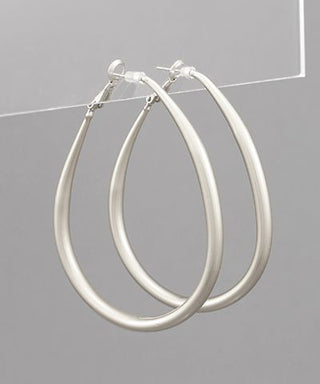 Silver-toned teardrop gradual hoop earrings with French post closure displayed on a neutral background from The Pink Doxie Boutique.