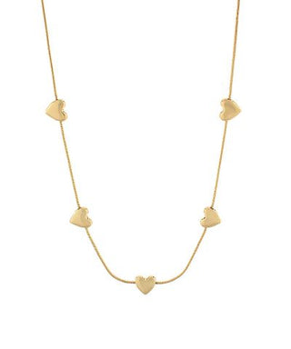 Gold-tone puffy heart station necklace with evenly spaced heart charms, photographed for The Pink Doxie Boutique.