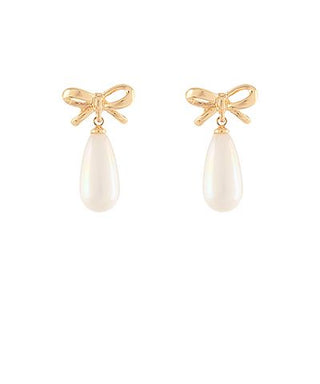 Gold bow earrings with teardrop faux pearl drops displayed on a white background from The Pink Doxie Boutique.