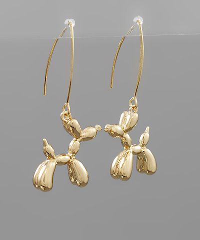 Metal balloon dog drop earrings with fish hook backing in a metallic finish displayed on a neutral background from The Pink Doxie Boutique.