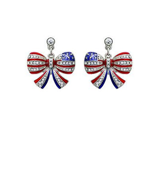 Patriotic flag bow earrings with red, white, and blue crystal detailing on a white background from The Pink Doxie Boutique.