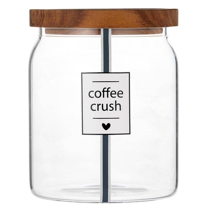 Clear glass canister labeled “coffee crush” with acacia wood lid — airtight coffee storage jar from The Pink Doxie Boutique.