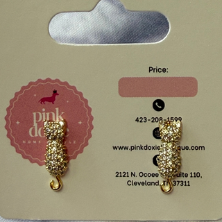 Gold sparkle cat earrings on a Pink Doxie & Co. branded card with contact information.