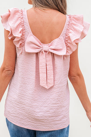 Pink butterfly sleeve blouse with textured fabric and bow knot back detail, feminine and stylish top from The Pink Doxie Boutique.