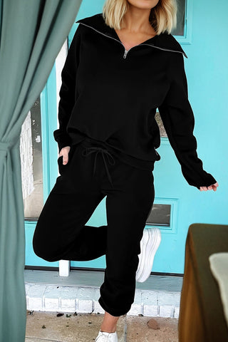 Black long sleeve quarter-zip top with matching jogger pants, a cozy and stylish two-piece lounge set from The Pink Doxie Boutique.