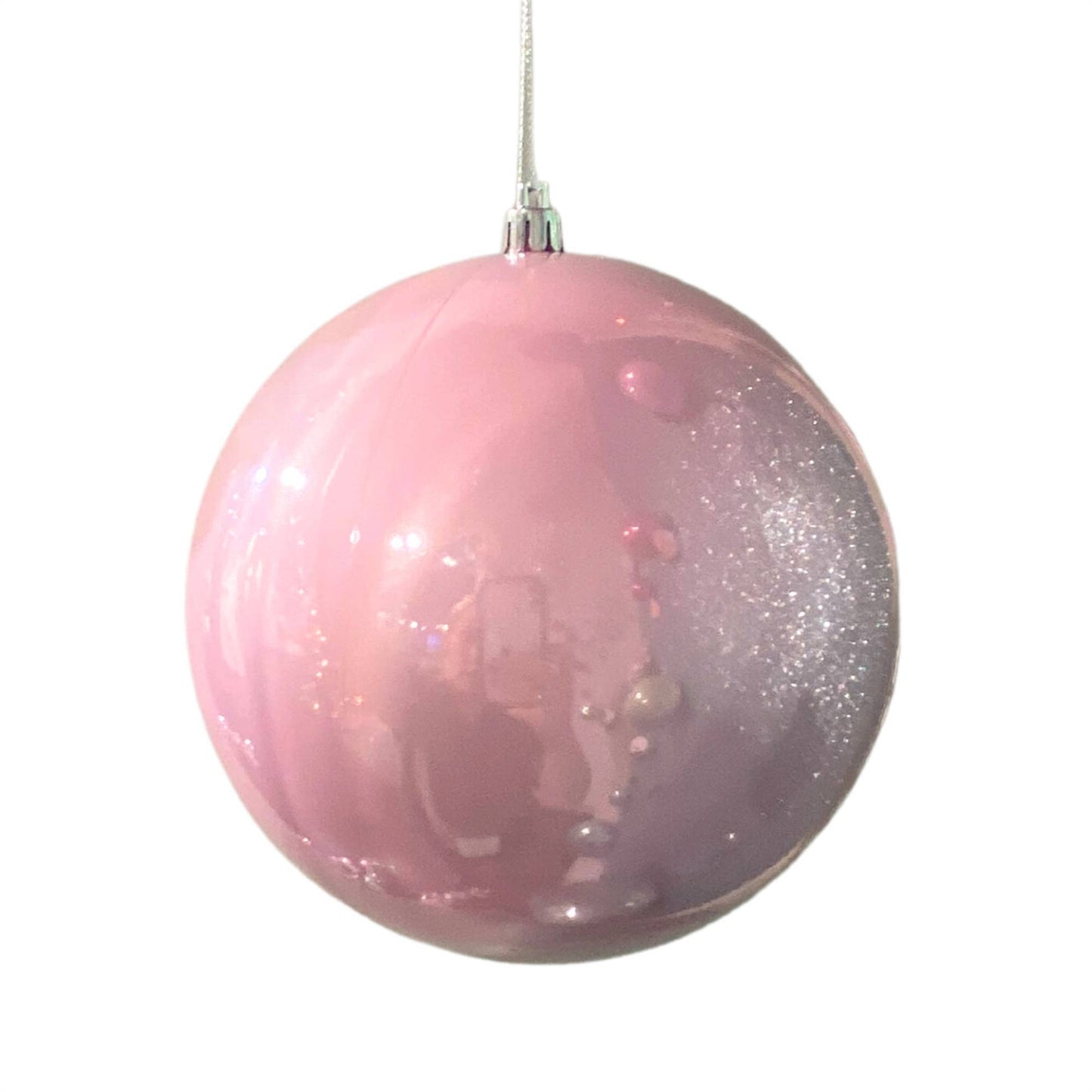 Light pink candy apple finish Christmas ornament with glossy shine.