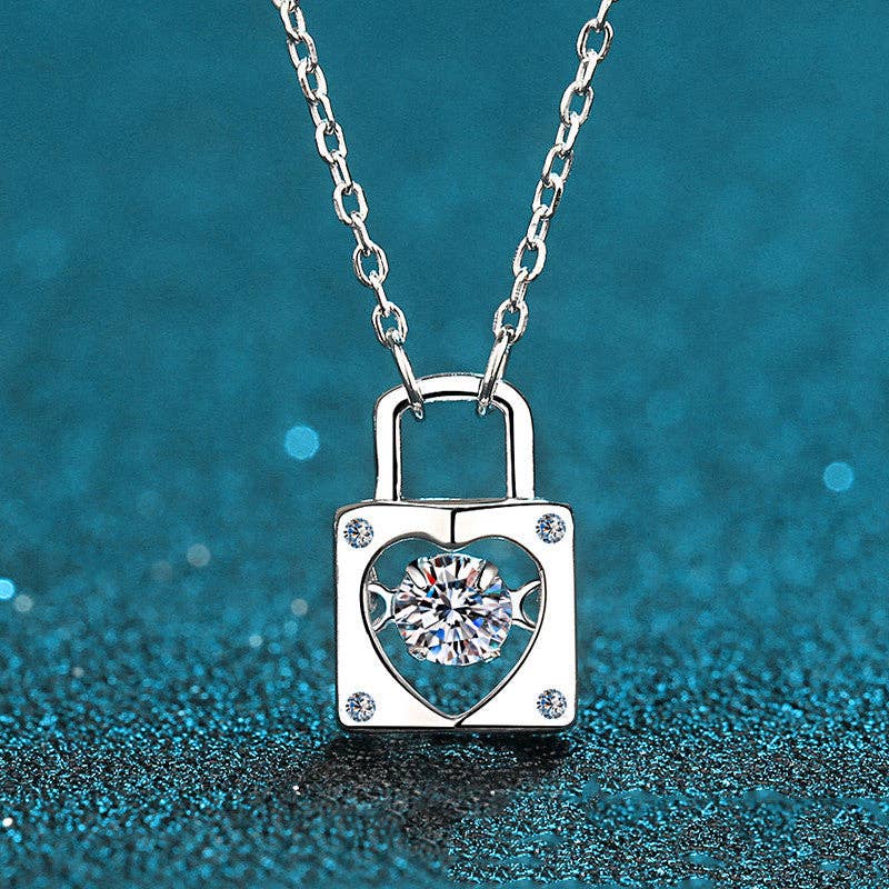 Sterling silver heart lock pendant necklace featuring a round D-color moissanite center stone on a silver chain — handcrafted fine jewelry from The Pink Doxie.
