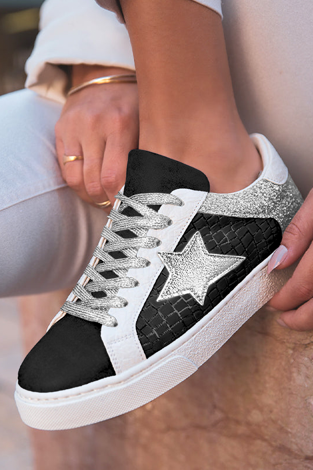 Black glitter star patchwork PU leather sneakers with silver glitter heel and lace-up closure — preorder from The Pink Doxie Boutique.