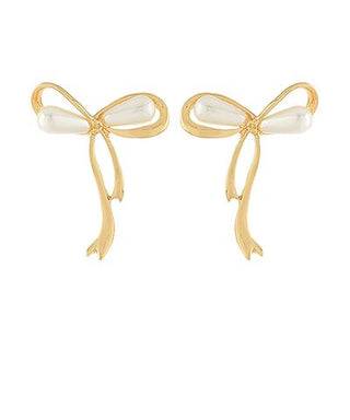 Gold-tone ribbon-shaped drop earrings featuring faux pearl accents on a white background from The Pink Doxie Boutique.