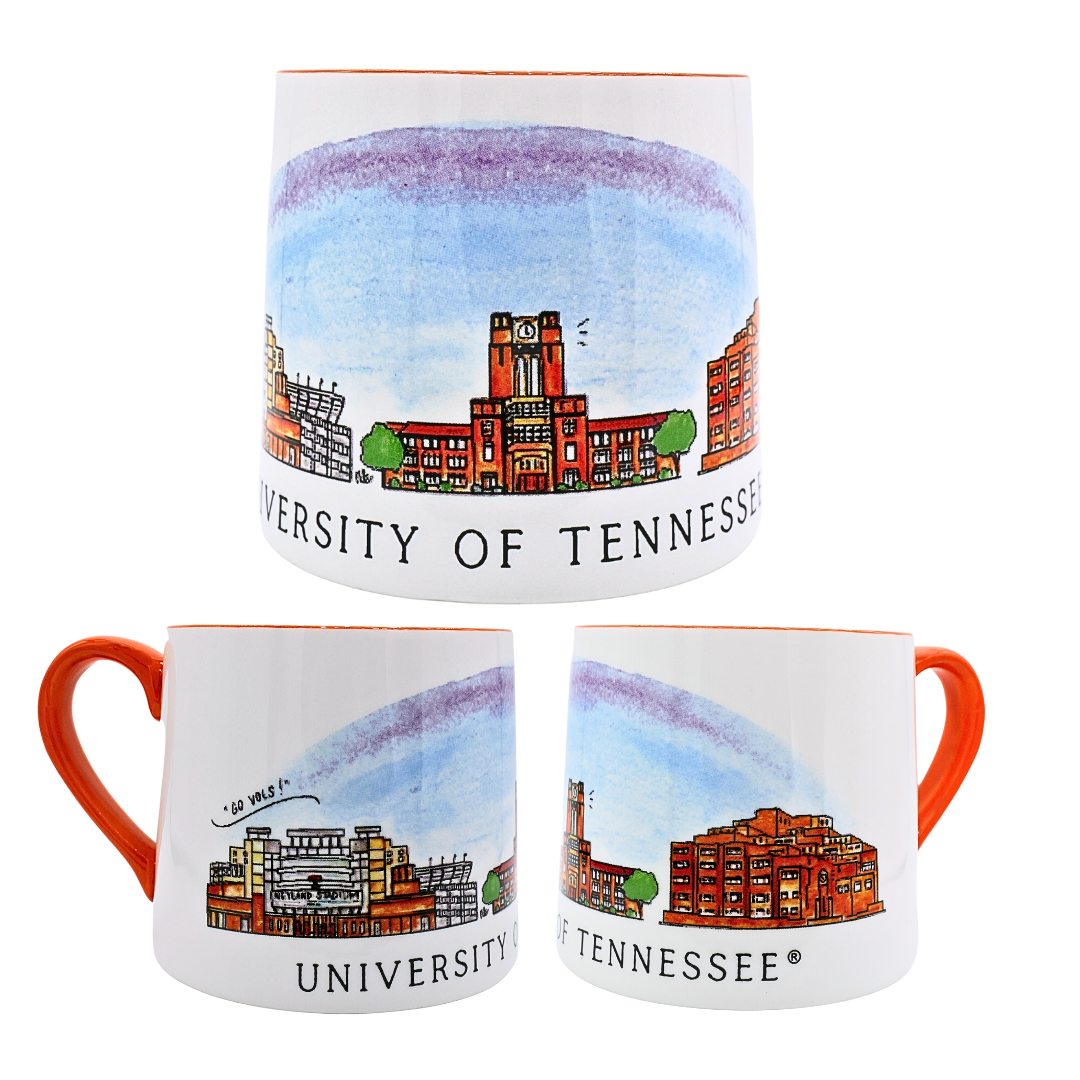 Tennessee ceramic mug featuring University of Tennessee campus skyline artwork with orange handle and accents.