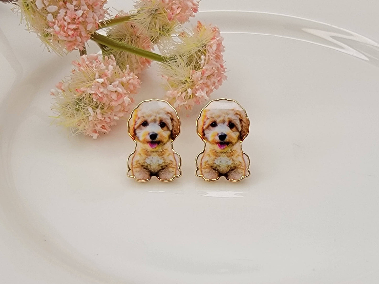 Golden doodle post earrings with gold-tone outline and cubic zirconia accents displayed on a white background from The Pink Doxie Boutique.
