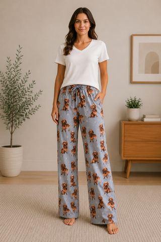 Person wearing dachshund-themed pajama bottoms with adjustable drawstring and side pockets.