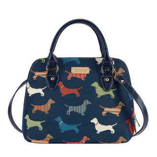 Multicolor tapestry purse with dachshund pattern, top handle, and detachable strap.