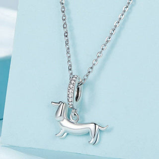 Dachshund pendant necklace in copper with cubic zirconia and adjustable chain.