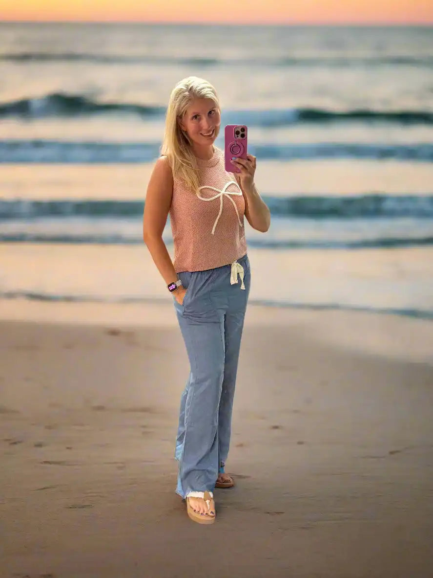 Woman in casual beach attire.