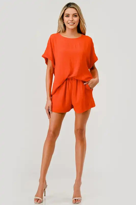 Woman’s orange two-piece shorts set.